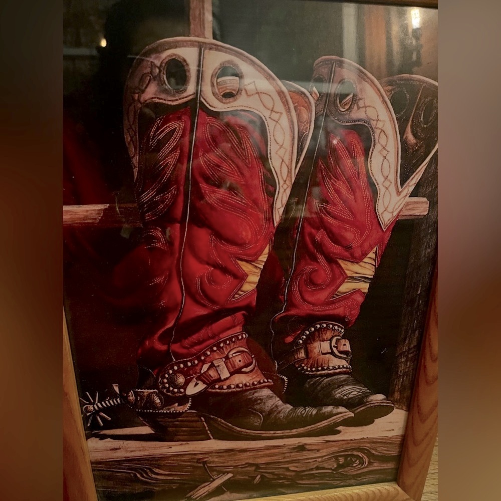 Painting of cowboy boots in a wood frame. Excellent condition